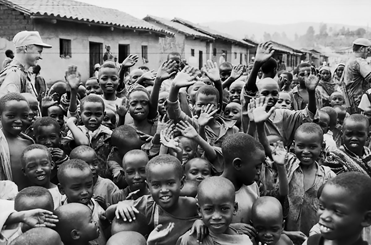 Children waving to camera, Rwanda 