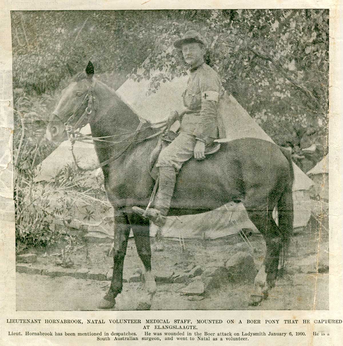 Rupert on horse outside camp