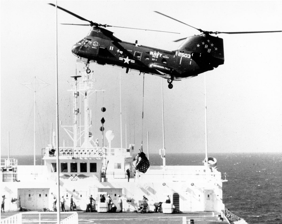 Helicopter dropping supplies to USNS Comfort